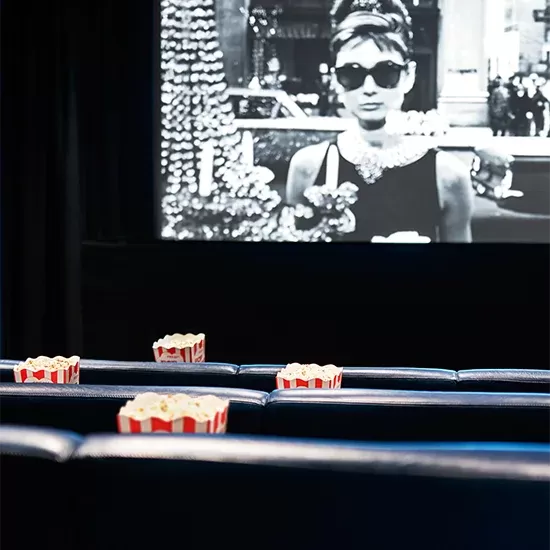 Cinema screen and seats with popcorn at The Screening Room at One Aldwych.