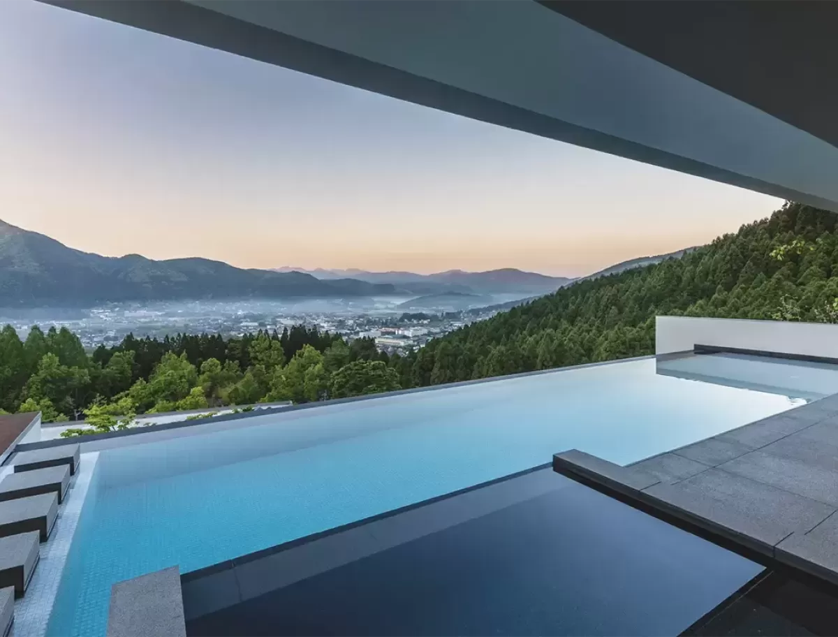 Hillside luxury resort pool with view at Enowa in Yufuin, Japan