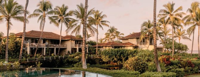 Palm trees and lake on the grounds of The For Seasons Resort, Hualalai, Hawaii