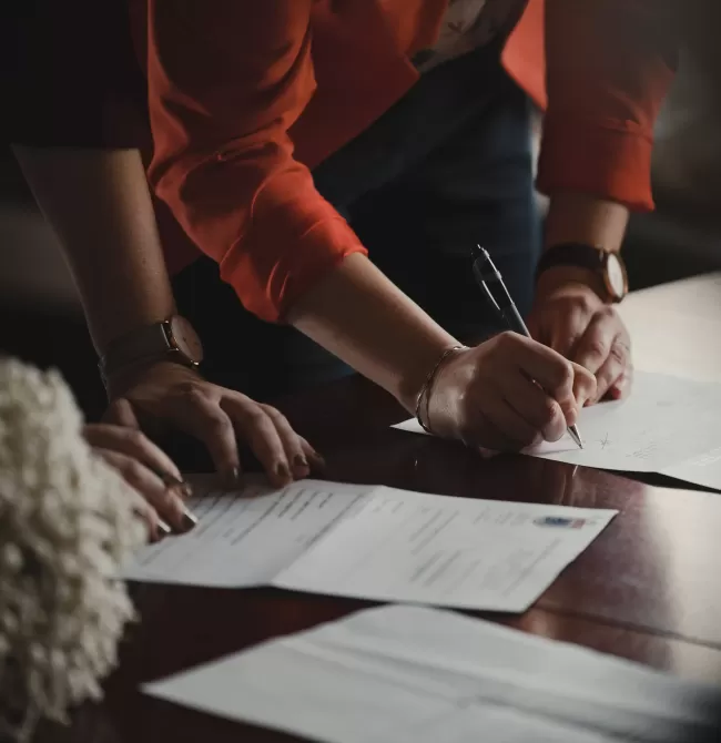 People signing paprerwork