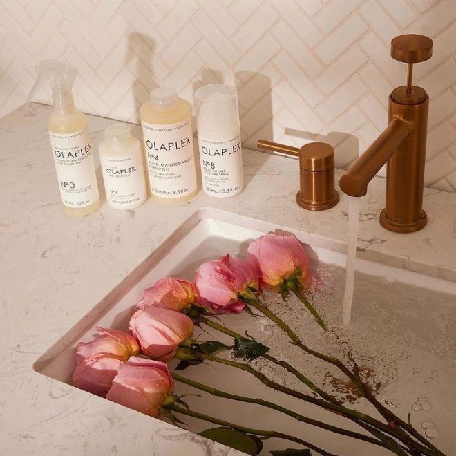Olaplex bottles with rose petal sink