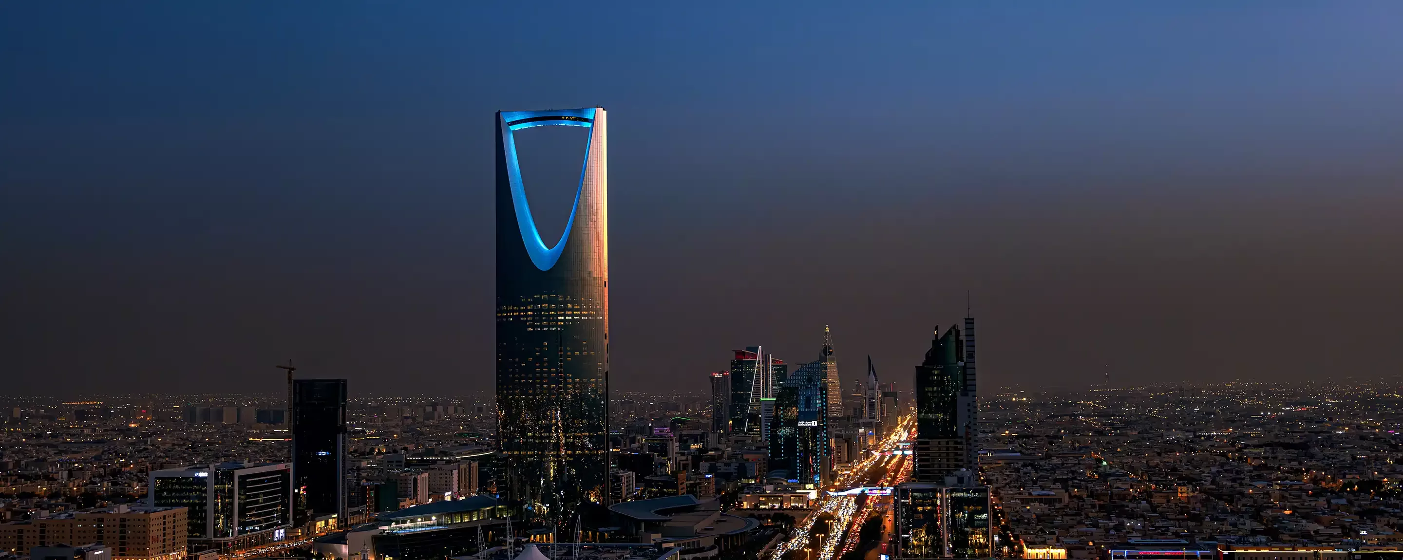 Birdseye view of Riyadh city skyline with building lit up at night in Riyadh, Saudi Arabia